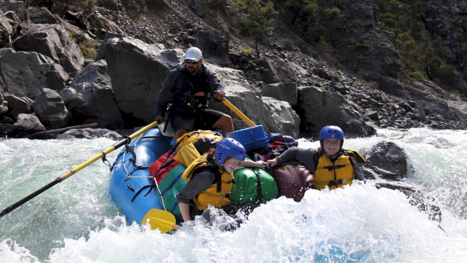 A gear raft and passengers on the Ngaruroro River