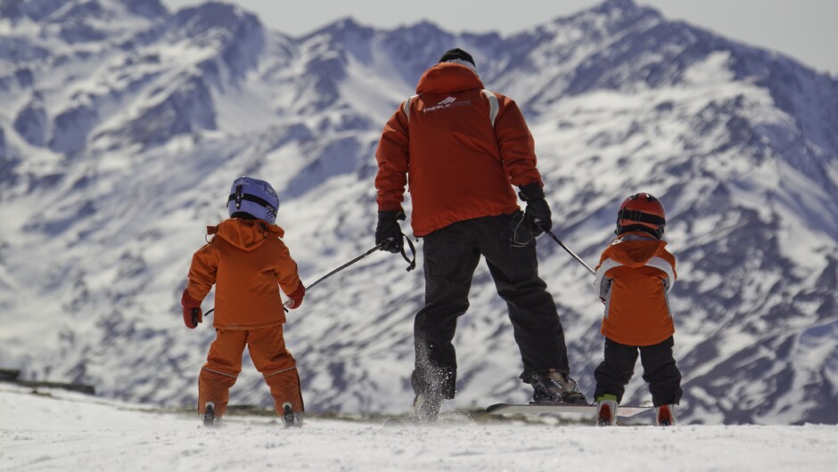 A couple of mini skiers getting a tow from one of our Treble Cone instructors.