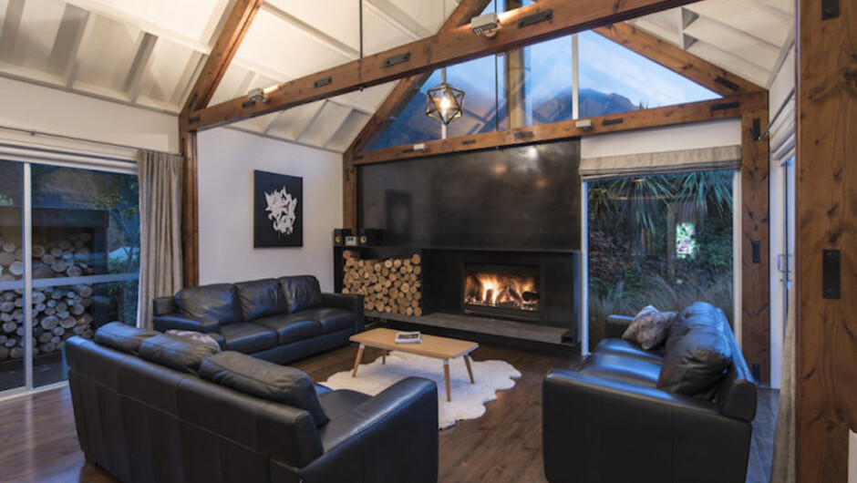 Steel feature wall and large open fireplace with fire screen