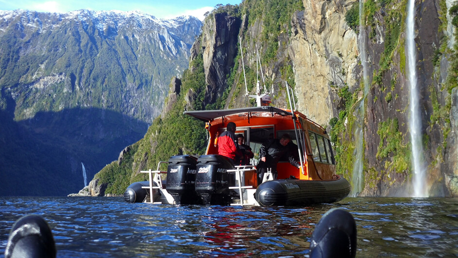 The stunning Milford Sound topside scenery with our dive vessel Westbay.