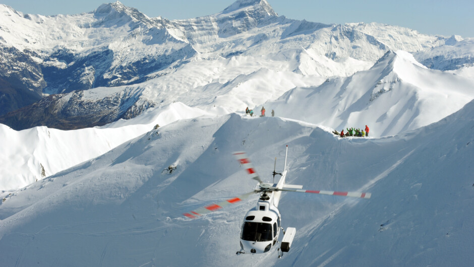 A helicopter off to pick up the next load. Mt Aspiring as a backdrop