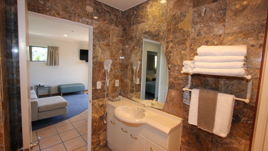 Gorgeous marble and tile bathrooms.