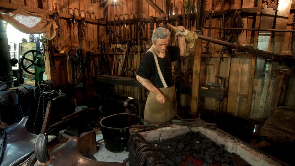 The "Smithy" shows the work of a blacksmith.