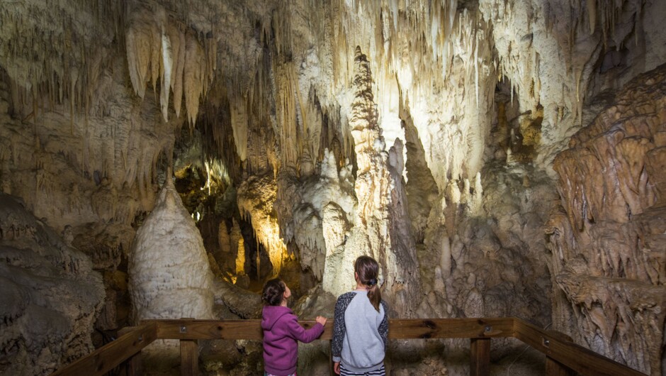 Two children looking out to the incredible cave formations.