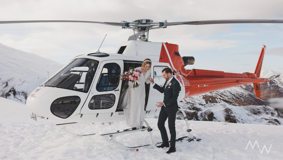 The happy couple arriving to their snow capped location