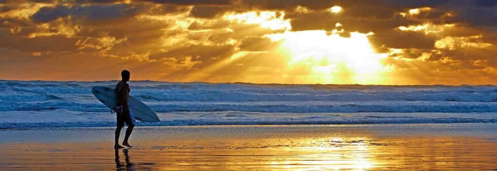 Surfing Muriwai, Auckland New Zealand.