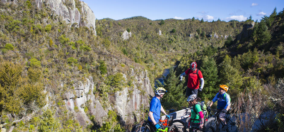 Ride through rich native bush and past towering volcanic cliffs on this epic cycle trail.