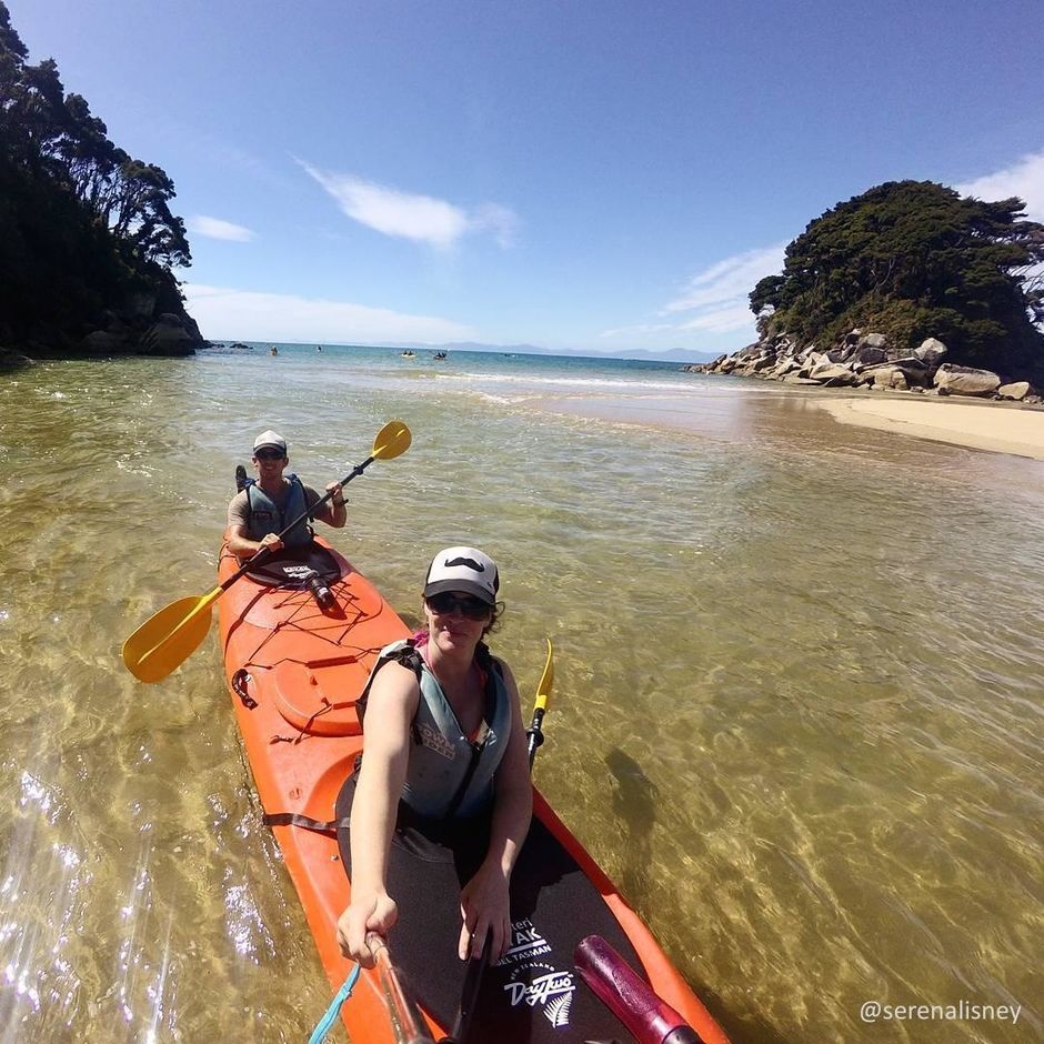 Kayakers enjoying the crystal clear waters and beautiful beaches in sunny Nelson.