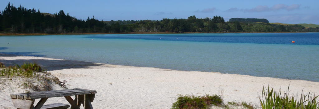 The crystal-clear Kai Iwi Lakes are popular with kiwi holidaymakers.