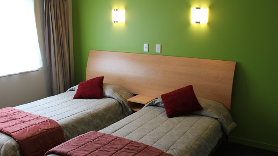 Family units (i.e., one and two bedroom units) come with a separate bedroom that contains two comfortable single beds.