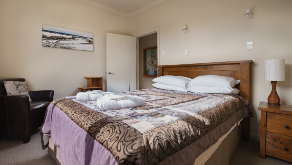 The middle queen bedroom looks onto the side garden.