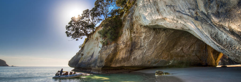 A giant hole in the rock connects beautiful beaches