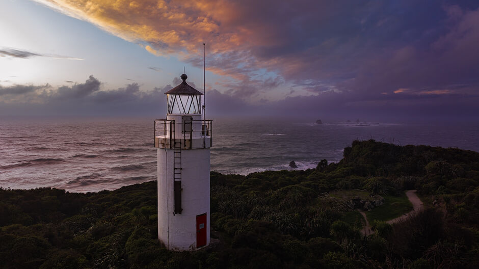 Aerial view of Cape Foulwind lighthouse at dawn