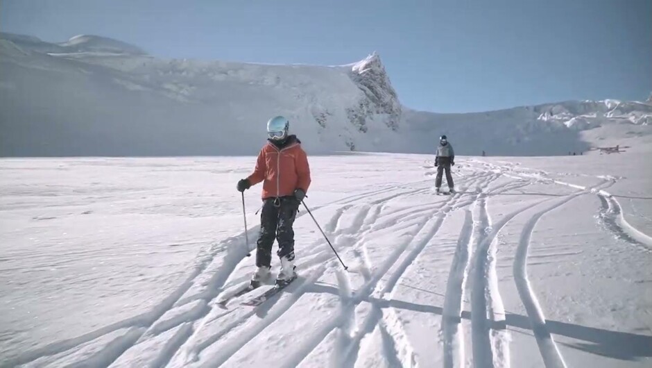 Explore New Zealand's largest glacier, its blue ice caves, and incredible ice formations while you link turns down our longest ski runs.