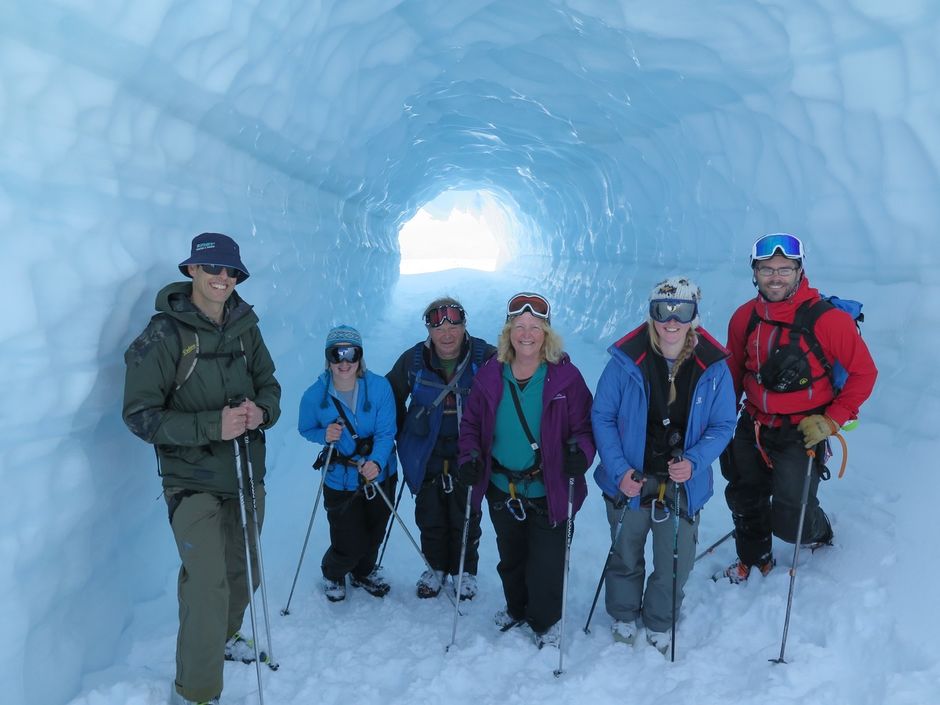 Skiers in ice cave on the Tasman glacier, Mackenzie region