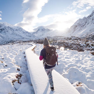 Woman snowshoeing in the Hooker Valley