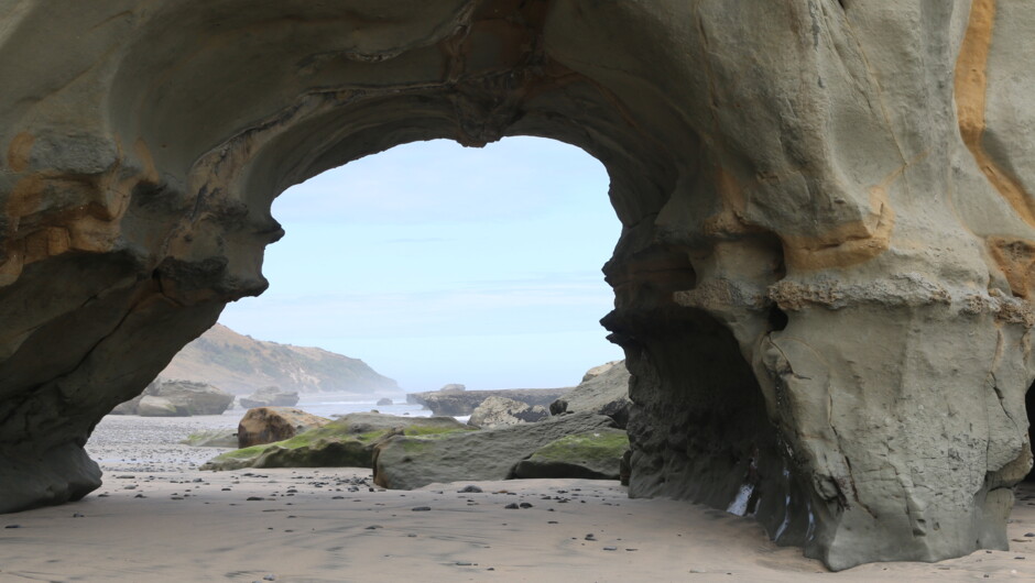 Walk along the beach to the arch