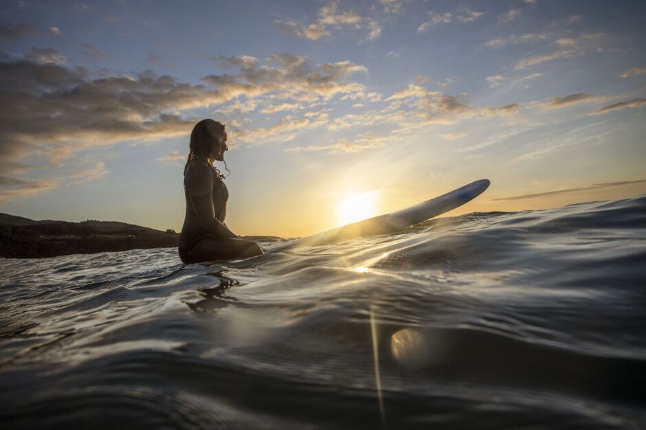 Surfing at sunset