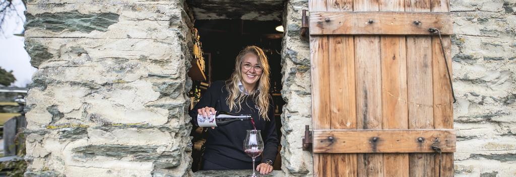 Pouring a glass of red wine at Millbrook Resort in Arrowtown