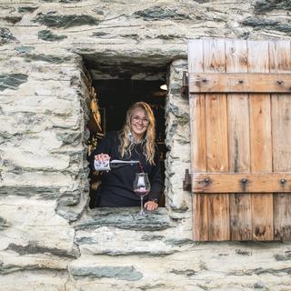 Pouring a glass of red wine at Millbrook Resort in Arrowtown