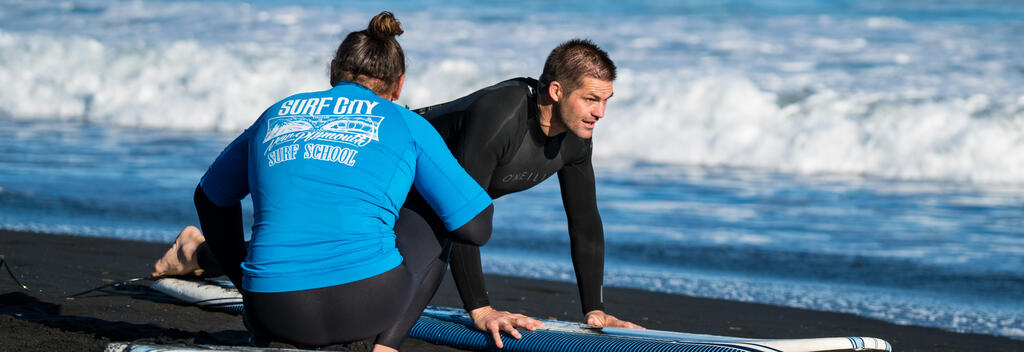 Richie McCaw surfing with Nau Mai Tours