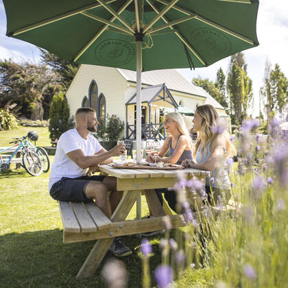 Group of cyclists taking a break at Cargo Brewery, Queenstown 