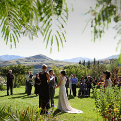 Choose to say &#039;I do&#039; amidst our stunning gardens and share a moment that you will remember for a lifetime, surrounded by majestic oaks and tranquil water features, with the unmistakable backdrop of the lake and mountains silhouetted against the sky.