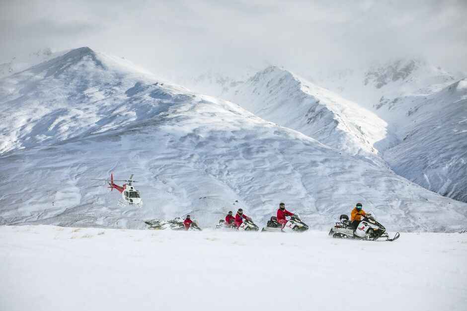 Guided snowmobile tours across Garvie Plateau, Queenstown 
