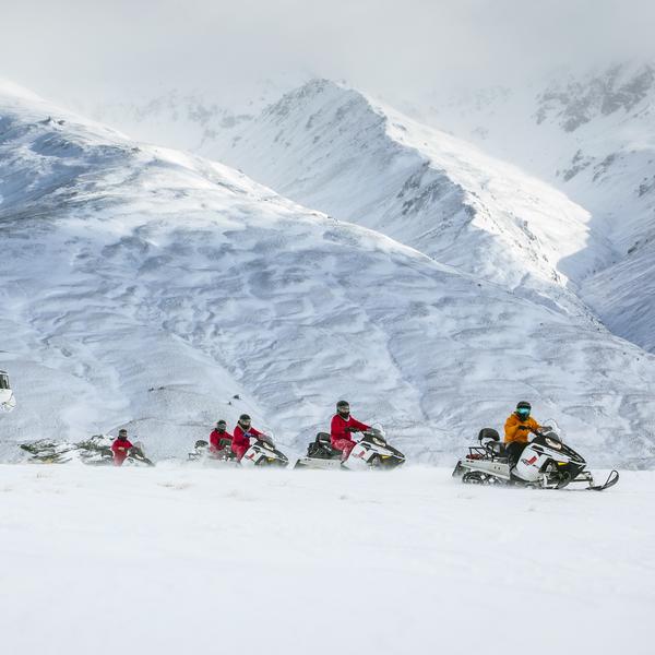 Guided snowmobile tours across Garvie Plateau, Queenstown 