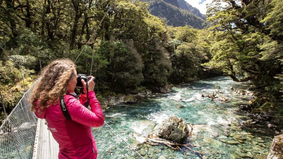 Explore the Hollyford River with the guide on our short walk option.