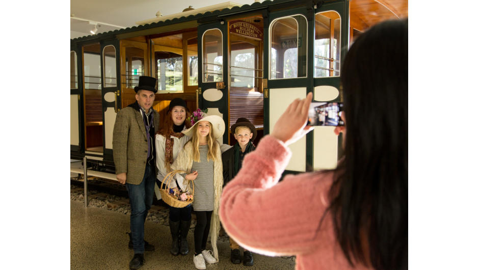 Family dressing up in the 1900s attire in the Cable Car Museum