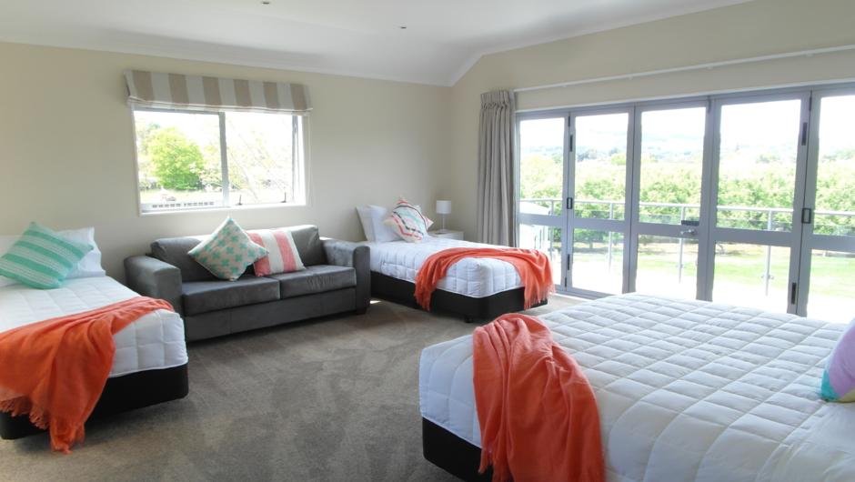 Room # 3 - a super king bed & 2 single beds - opens onto back balcony with stunning views of Te Mata Peak