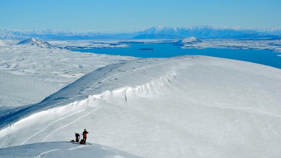 Nordic ski tourers on Snake Ridge looking south towards Lake Tekapo