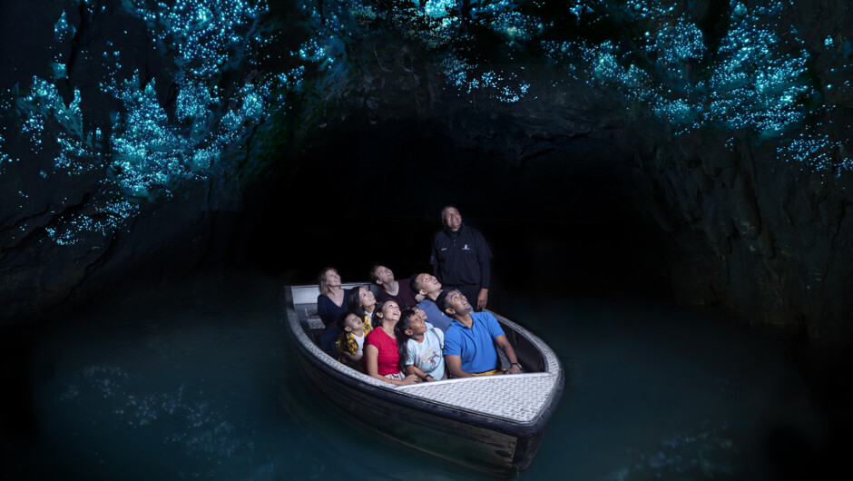 Admire thousands of glowworms in the glowwrom-studded Waitomo Glowworm Caves as you drift silently through by boat