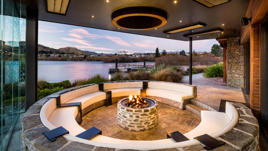 Relax with a drink in front of the fire in our decadent Pinot Pit with sweeping views of Lake Wakatipu.