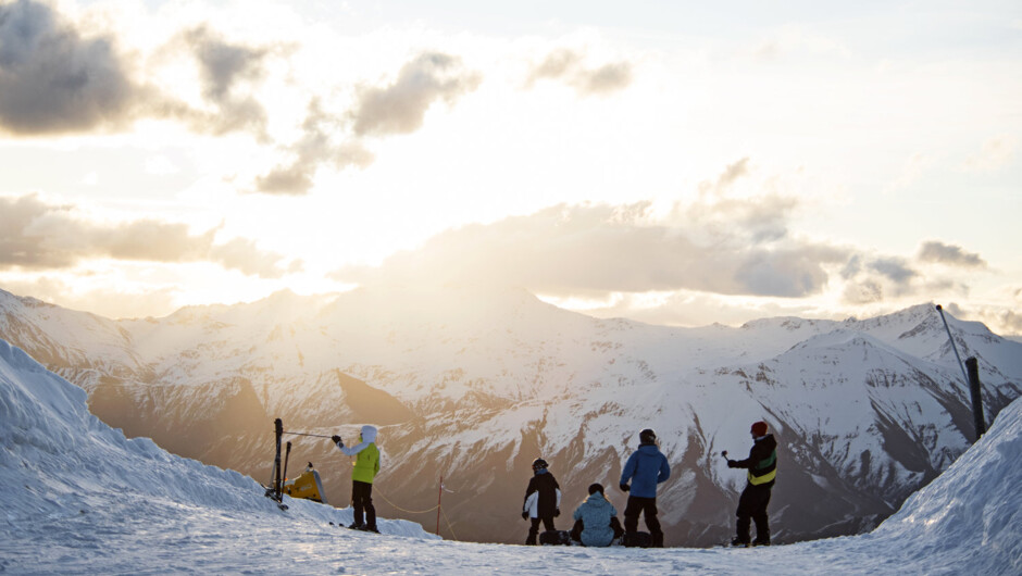 Night Ski transfers to Coronet Peak - Friend enjoying sunset on the slopes