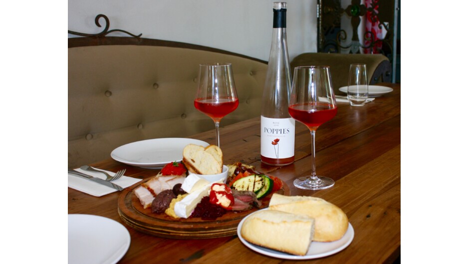 Enjoy a platter at Poppies Winery in Martinborough, one of New Zealand’s premium wine growing regions just an hour from Wellington.