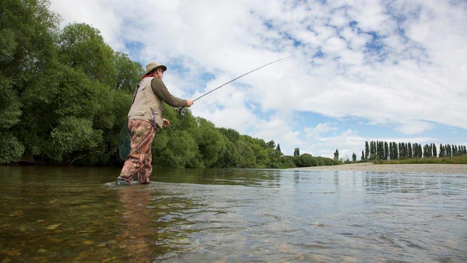 Fishing the Mataura River, Gore District. World famous for brown trout fly fishing.