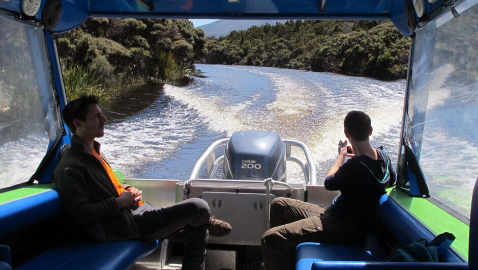 Clients aboard Aihe, travelling along the Freshwater River.