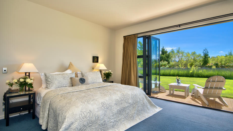 The master bedroom in our Black Peak Suite with stunning 180 degree mountain views