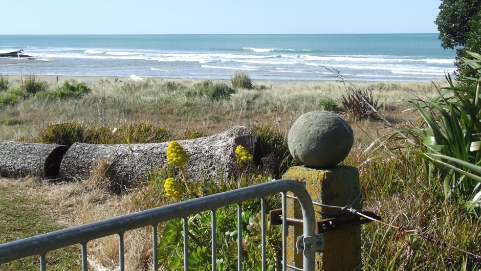 View across reserve to Waimarama beach from Esther's Cottage