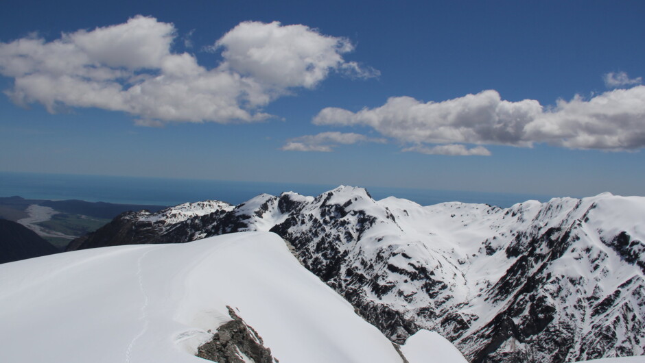 Views west to the Tasman Sea from the top on Chancellor Dome in spring
