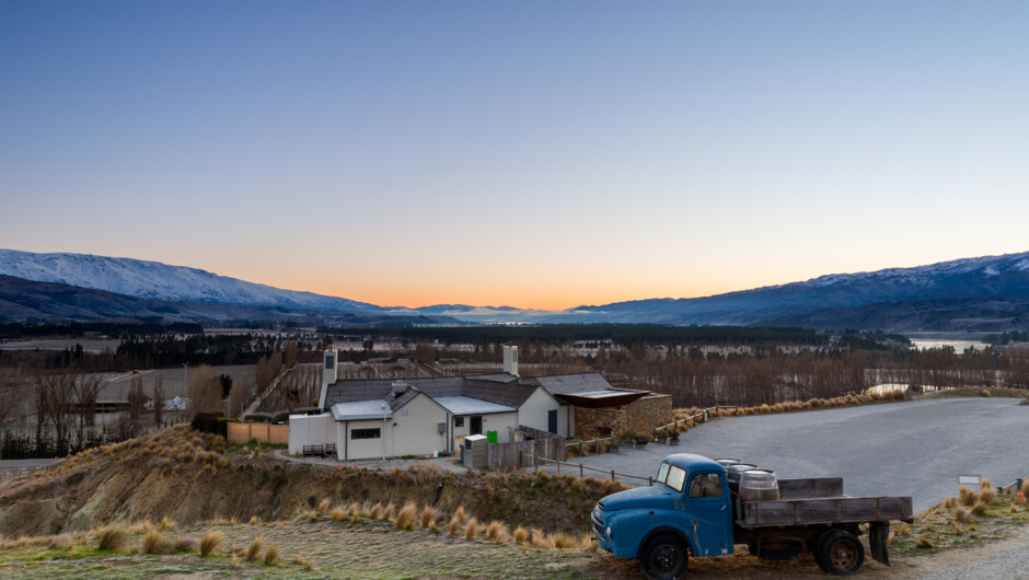 Mt Difficulty Cellar Door & Restaurant w Vintage Truck across Bannockburn and the Cromwell Basin