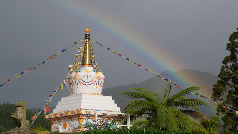 The Tibetan stupa (symbol of the enlightened mind) and prayer flags at Mahamudra Centre&#039;s entrance.
