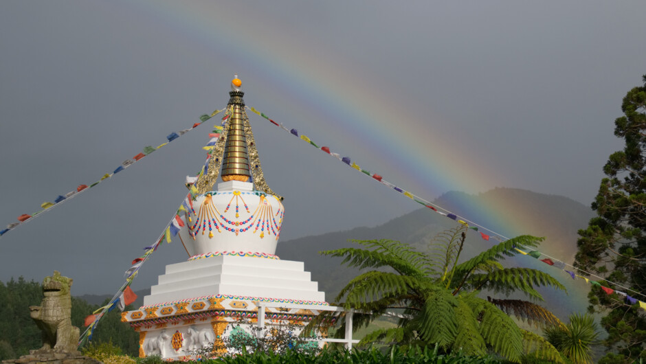 The Tibetan stupa (symbol of the enlightened mind) and prayer flags at Mahamudra Centre's entrance.