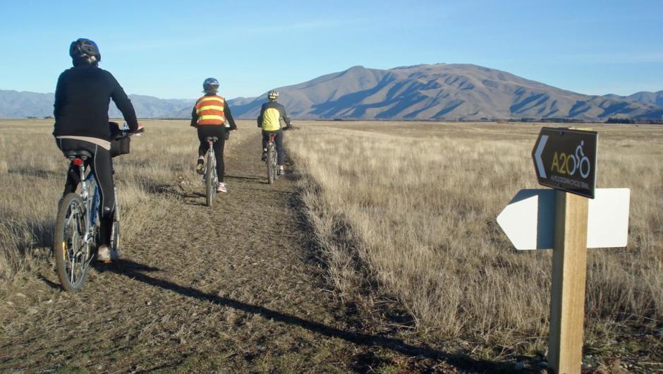 Cyclists on the Pukaki Flats section of the Alps 2 Ocean cycle trail