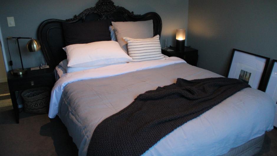 An ultra comfy queen size bed with high quality cotton linen and feather duvet.