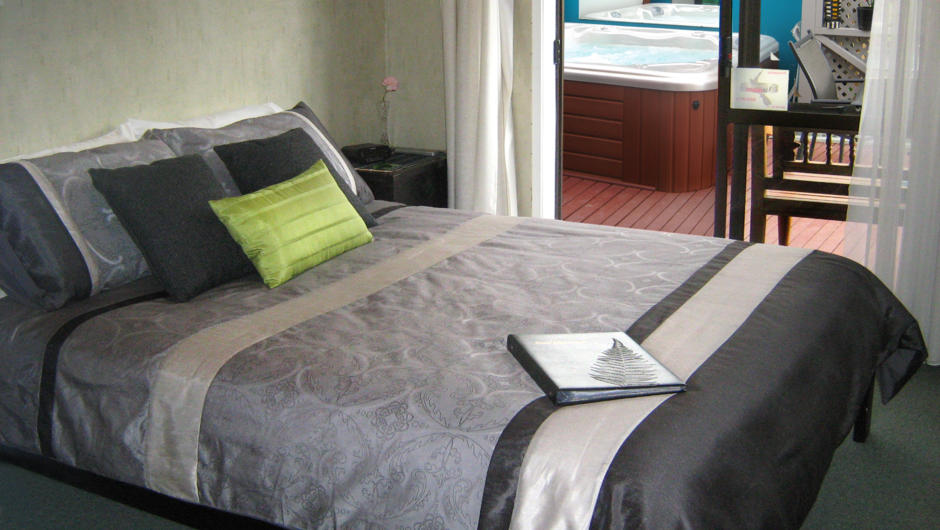 Bedroom 1 has direct access to deck area and spa pool, en-suite bathroom
