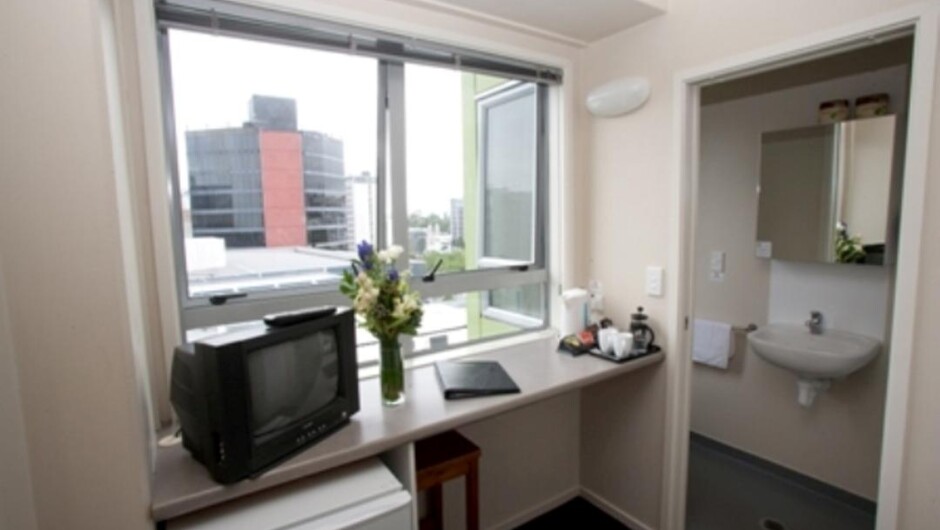 tv and fridge in room