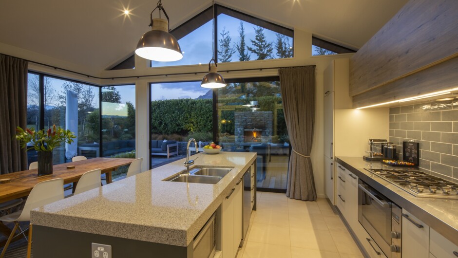 Modern kitchen with coffee machine and bar stools